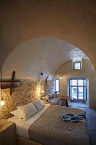 A bathroom featuring a sink and toilet part of a cellar accommodation in oia santorini with a private hot tub and veranda hu 486655deb92e316b.jpg